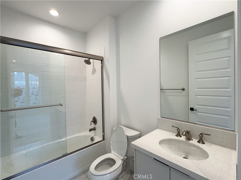 20138 Marlow Lane Porter Ranch, CA 91326 - Photo 29 of 32 a bathroom with a sink a toilet and shower