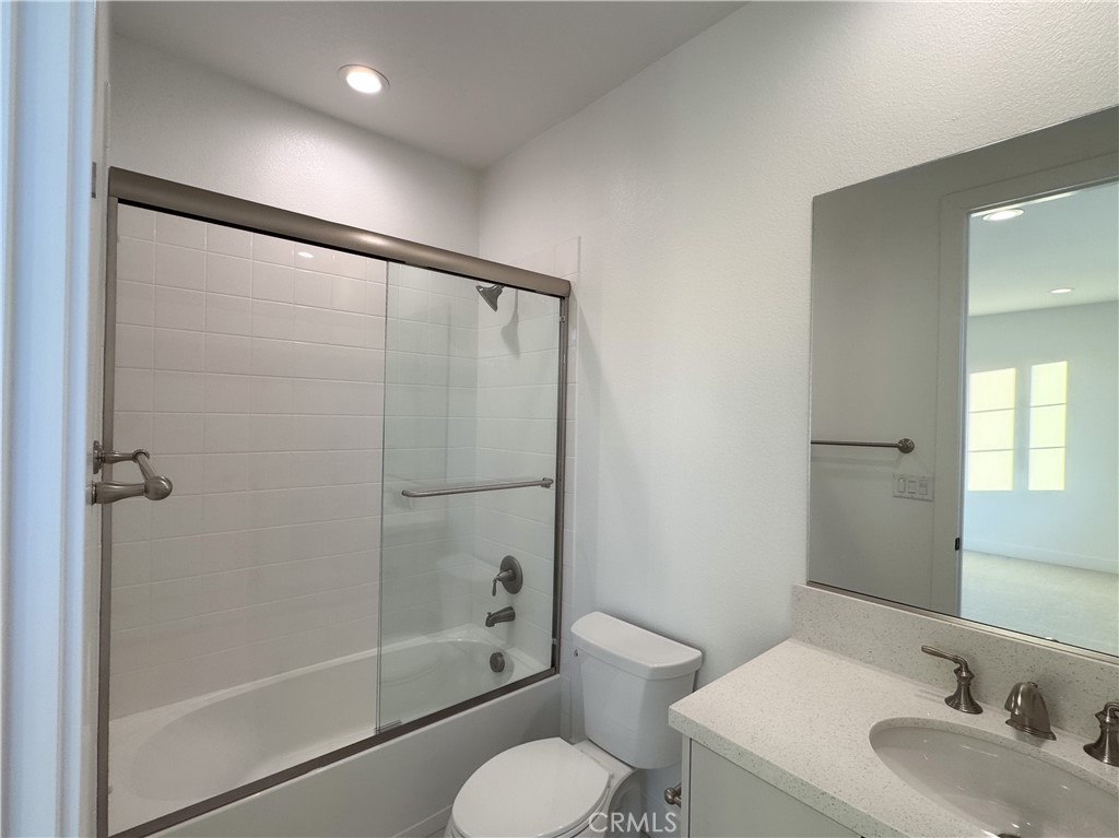 20138 Marlow Lane Porter Ranch, CA 91326 - Photo 31 of 32 a bathroom with a sink toilet and shower