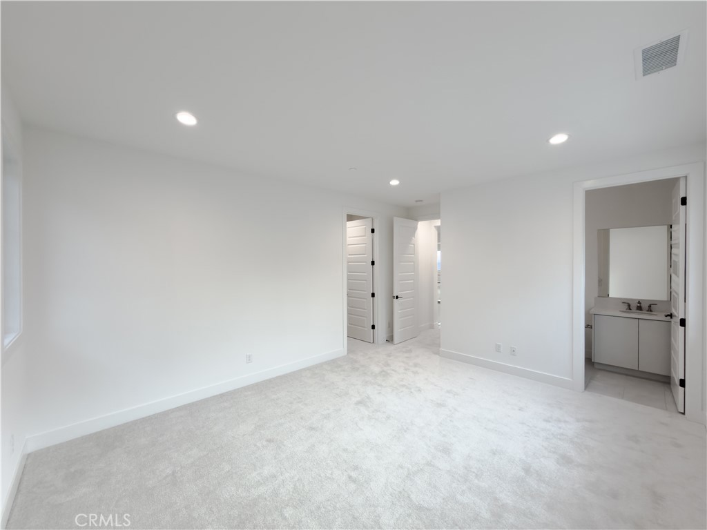 20138 Marlow Lane Porter Ranch, CA 91326 - Photo 35 of 36 an empty room with closet and windows