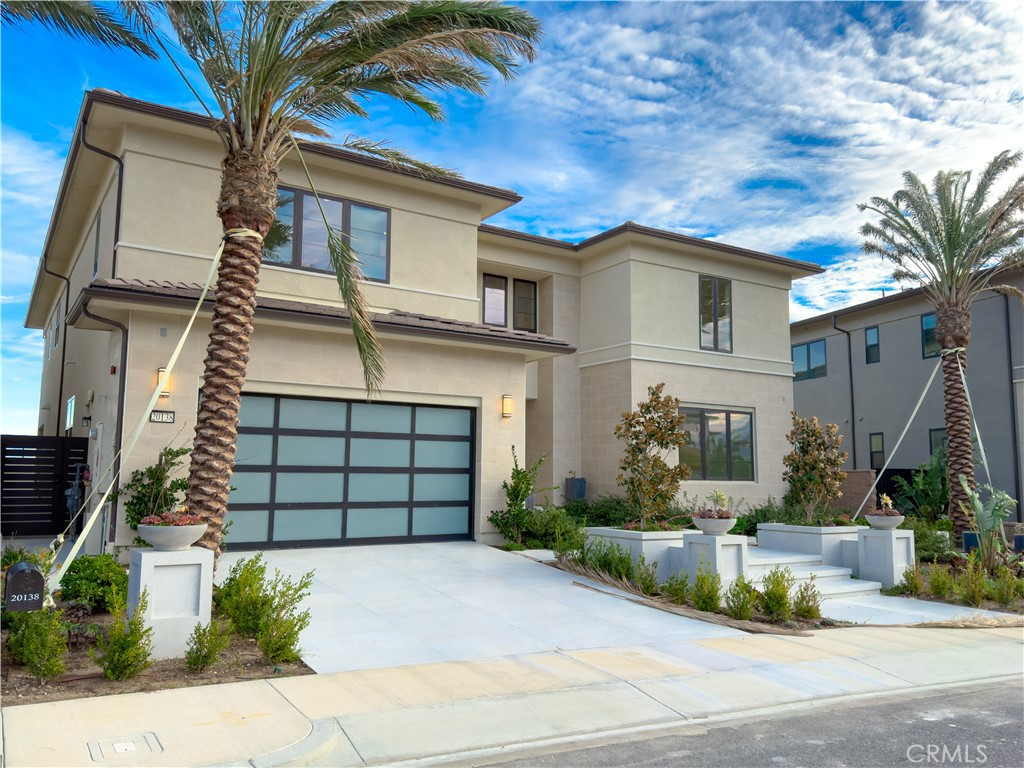 20138 Marlow Lane Porter Ranch, CA 91326 - Photo 6 of 36 a front view of a house with a garden