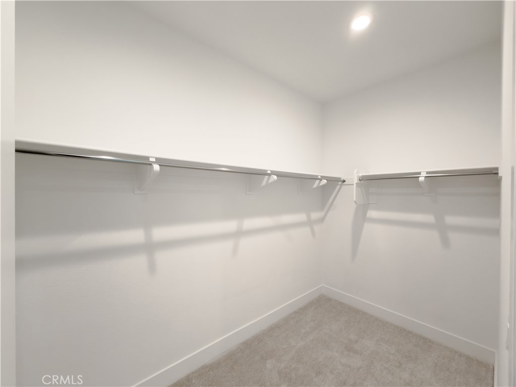 20138 Marlow Lane Porter Ranch, CA 91326 - Photo 10 of 36 a view of an empty walk in closet