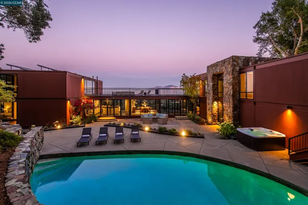 a view of a swimming pool with a patio
