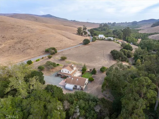 an aerial view of a house with a garden