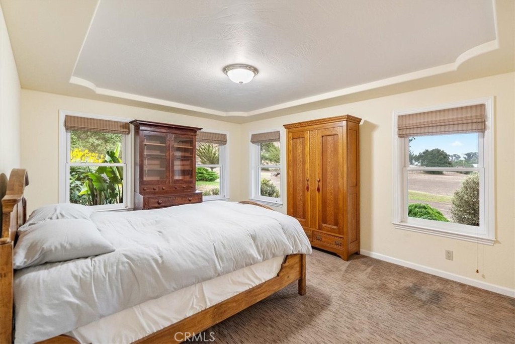 1155 Cayucos Creek Road Cayucos, CA 93430 - Photo 51 of 75 a bedroom with a large bed and a window