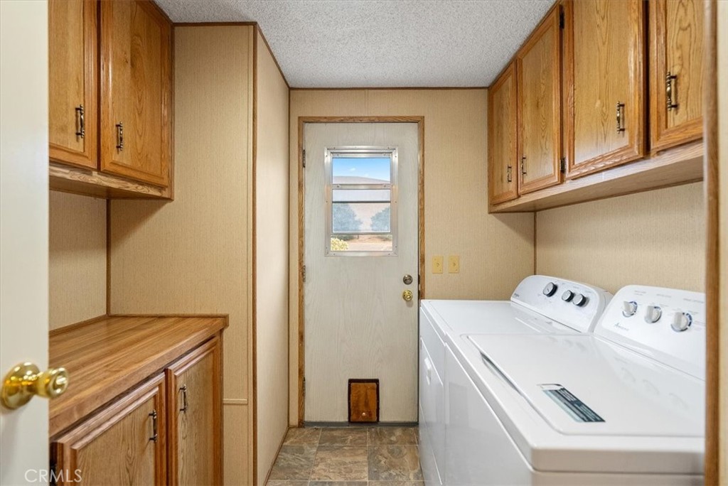 1155 Cayucos Creek Road Cayucos, CA 93430 - Photo 66 of 75 a utility room with dryer and washer