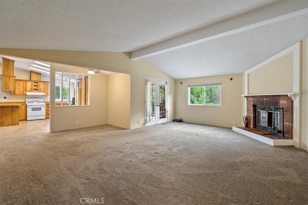 1155 Cayucos Creek Road Cayucos, CA 93430 - Photo 67 of 75 a view of a livingroom with an empty space and a fireplace