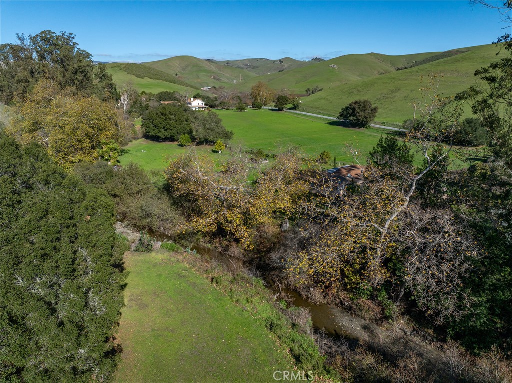 1155 Cayucos Creek Road Cayucos, CA 93430 - Photo 9 of 75 a view of a lush green hillside and houses