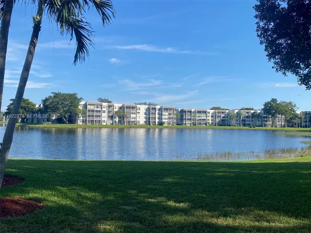 a view of a lake with houses in the background