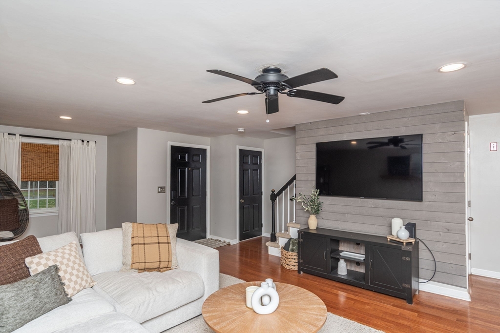 4 Colonial Drive, Unit 4 Norton, MA 02766 - Photo 12 of 34 a living room with furniture and a flat screen tv