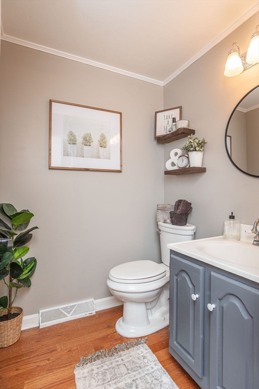 4 Colonial Drive, Unit 4 Norton, MA 02766 - Photo 16 of 34 a bathroom with a toilet a sink and mirror