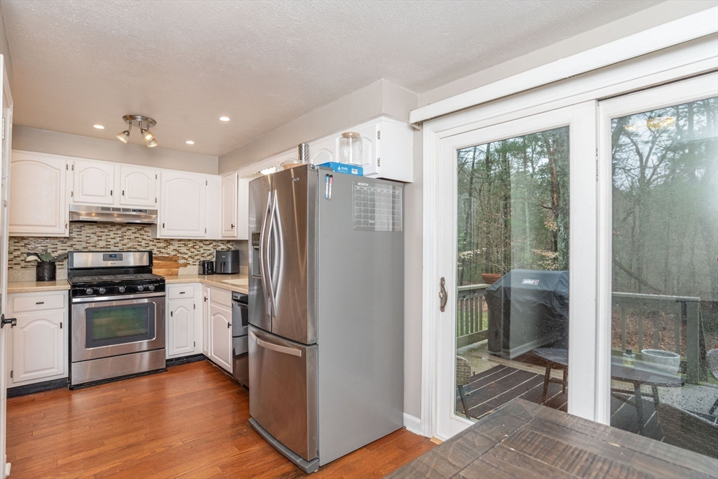 4 Colonial Drive, Unit 4 Norton, MA 02766 - Photo 18 of 34 a kitchen with stainless steel appliances a refrigerator sink and microwave