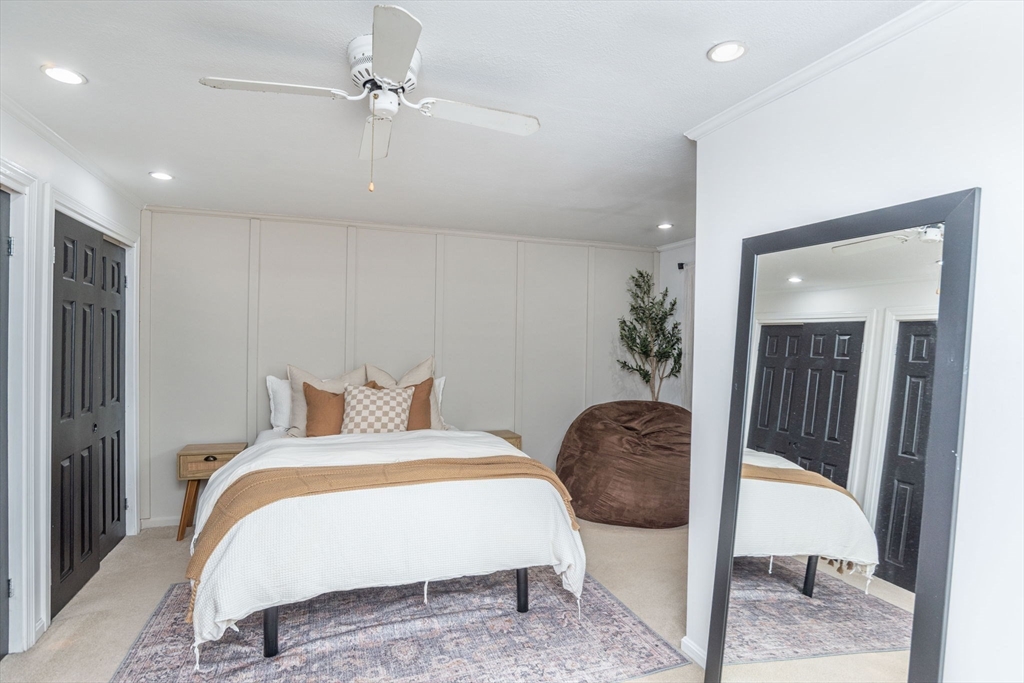 4 Colonial Drive, Unit 4 Norton, MA 02766 - Photo 24 of 34 a bedroom with a bed and dresser