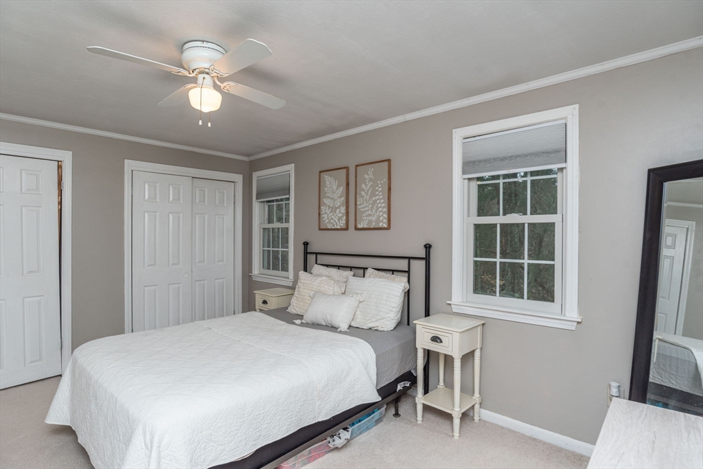 4 Colonial Drive, Unit 4 Norton, MA 02766 - Photo 28 of 34 a bedroom with a large bed and a window