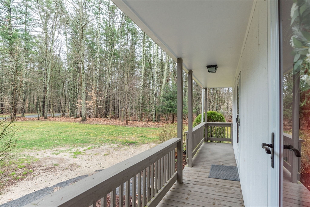 4 Colonial Drive, Unit 4 Norton, MA 02766 - Photo 3 of 34 a view of a porch and garden
