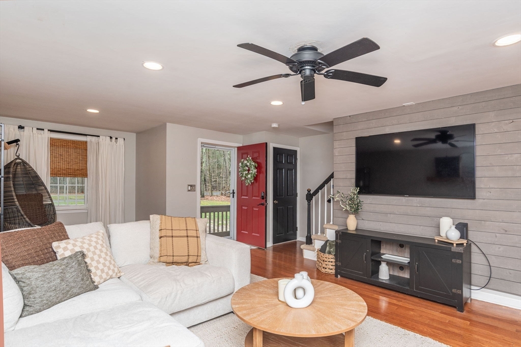 4 Colonial Drive, Unit 4 Norton, MA 02766 - Photo 9 of 34 a living room with furniture and a wooden floor