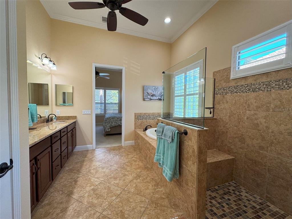 1024 West Beagle Run Loop Hernando, FL 34442 - Photo 32 of 44 a bathroom with sink shower and mirror