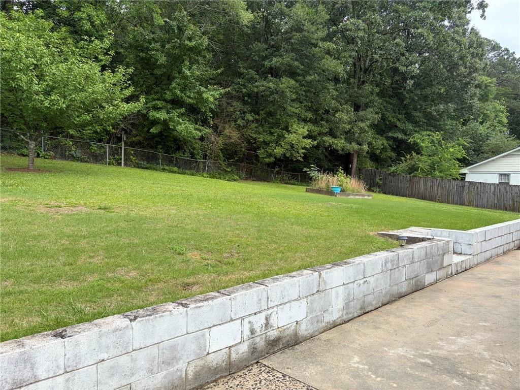 52 Lyons Drive Northwest Rome, GA 30165 - Photo 23 of 34 a view of a field with a big yard