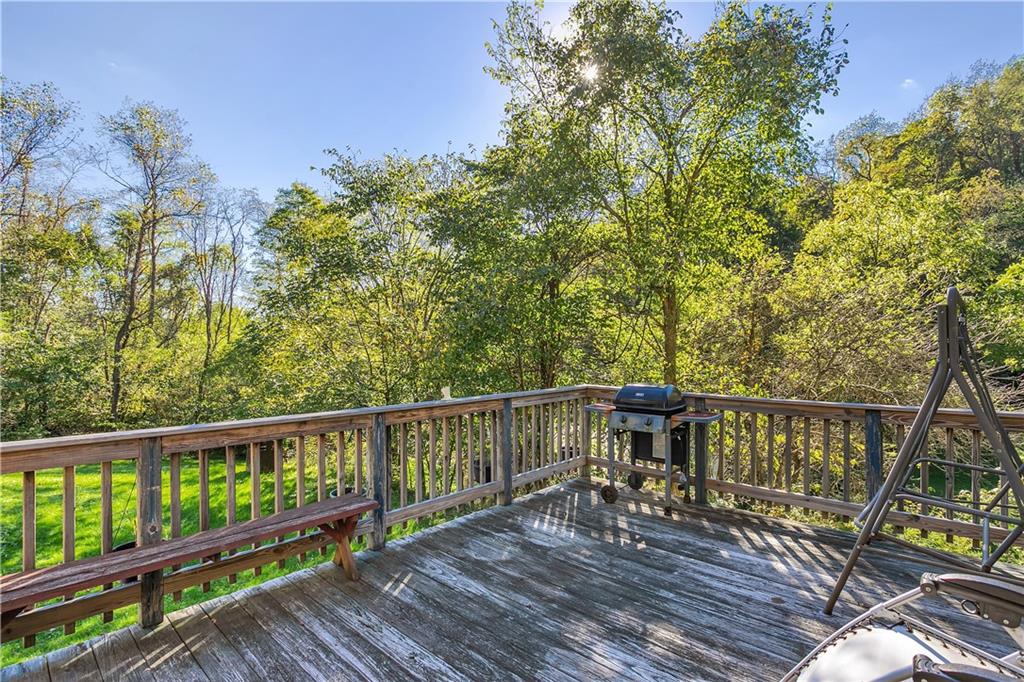 5986 Italy Road Export, PA 15632 - Photo 3 of 21 Deck on Left Side of the Home, Next to Off-Street Parking Area, Overlooks Backyard, and Opens to a Side Entry/Hallway.