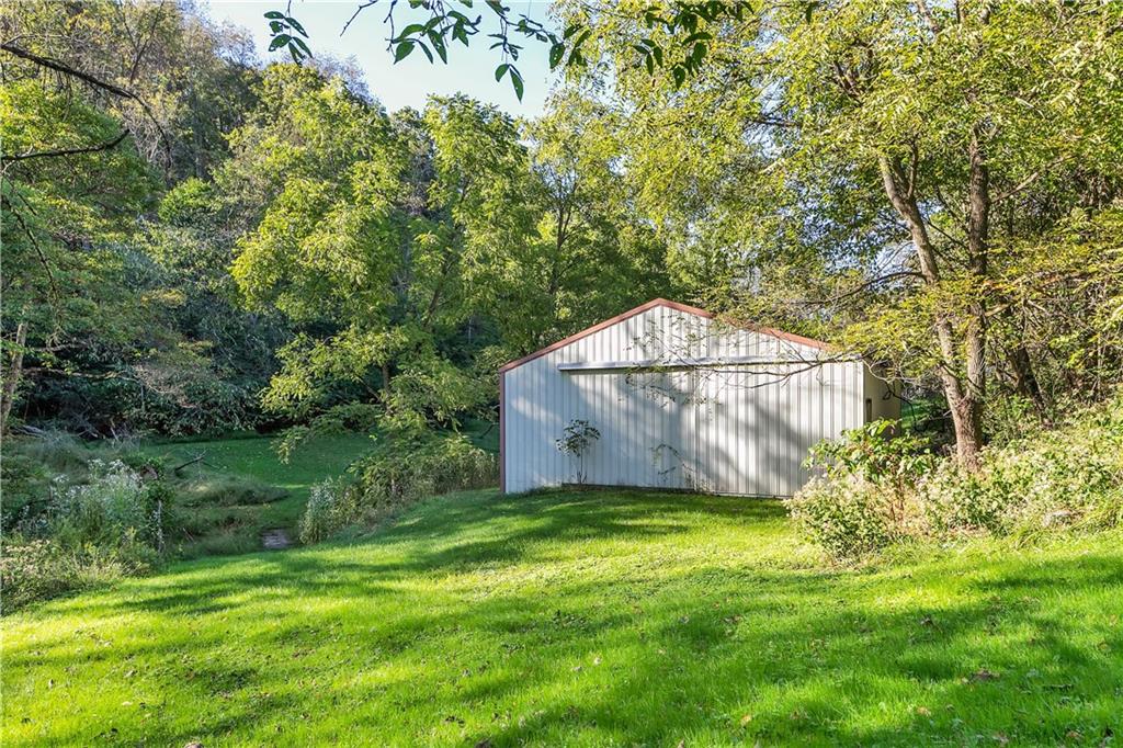5986 Italy Road Export, PA 15632 - Photo 5 of 21 29' 8' x 32' 4" Metal Outbuilding / Pole Barn -Side Door Entry on Right, Slide Front Entry. Located Below the Upper Parking Area.
