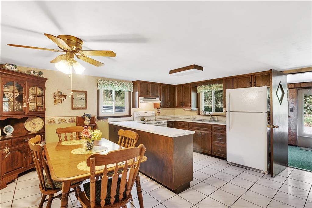 5986 Italy Road Export, PA 15632 - Photo 9 of 21 Spacious Eat in Kitchen with Large Penninsulas/PrepIsland, Tile Floor and Lots of Cabinetry and Counter Space.