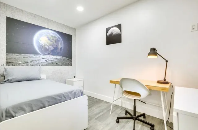 a living room with a couch and a flat screen tv