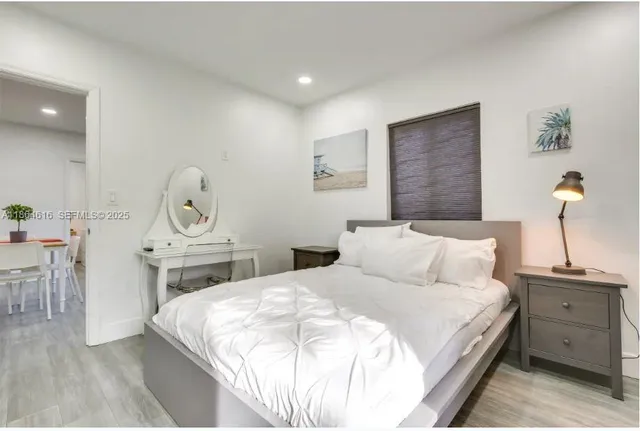 a bedroom with a bed and a table