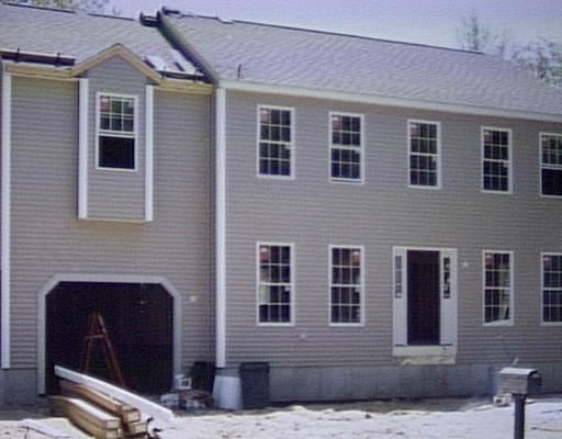 29 Pound Road Cumberland, RI 02864 - Photo 1 of 1 a front view of a house with a yard
