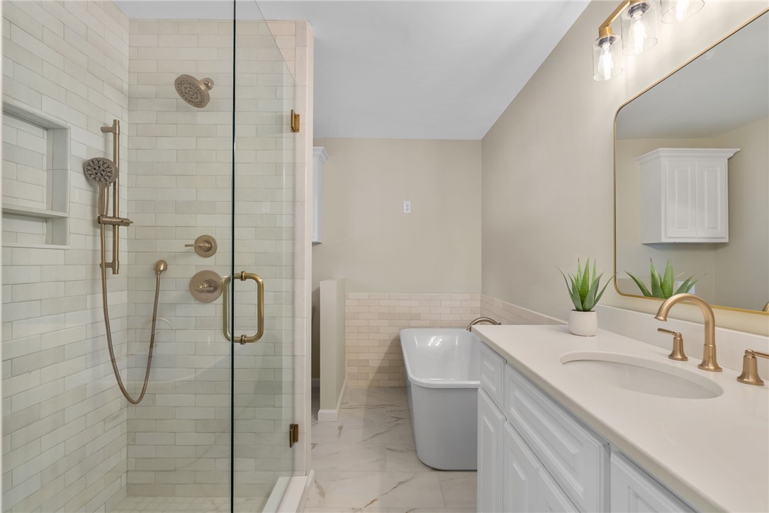 3513 Hopewell Road Anderson, SC 29621 - Photo 16 of 50 A refined bathroom features a spacious walk-in shower and a free-standing tub.