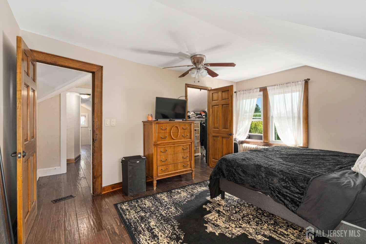 23 Reed Street Edison, NJ 08817 - Photo 15 of 27 a bedroom with a bed and wooden floor