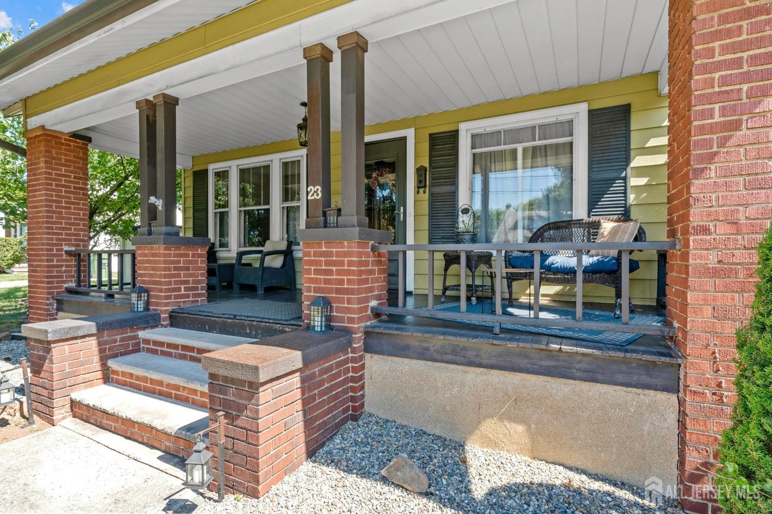 23 Reed Street Edison, NJ 08817 - Photo 4 of 27 a building outdoor space with patio furniture and potted plants