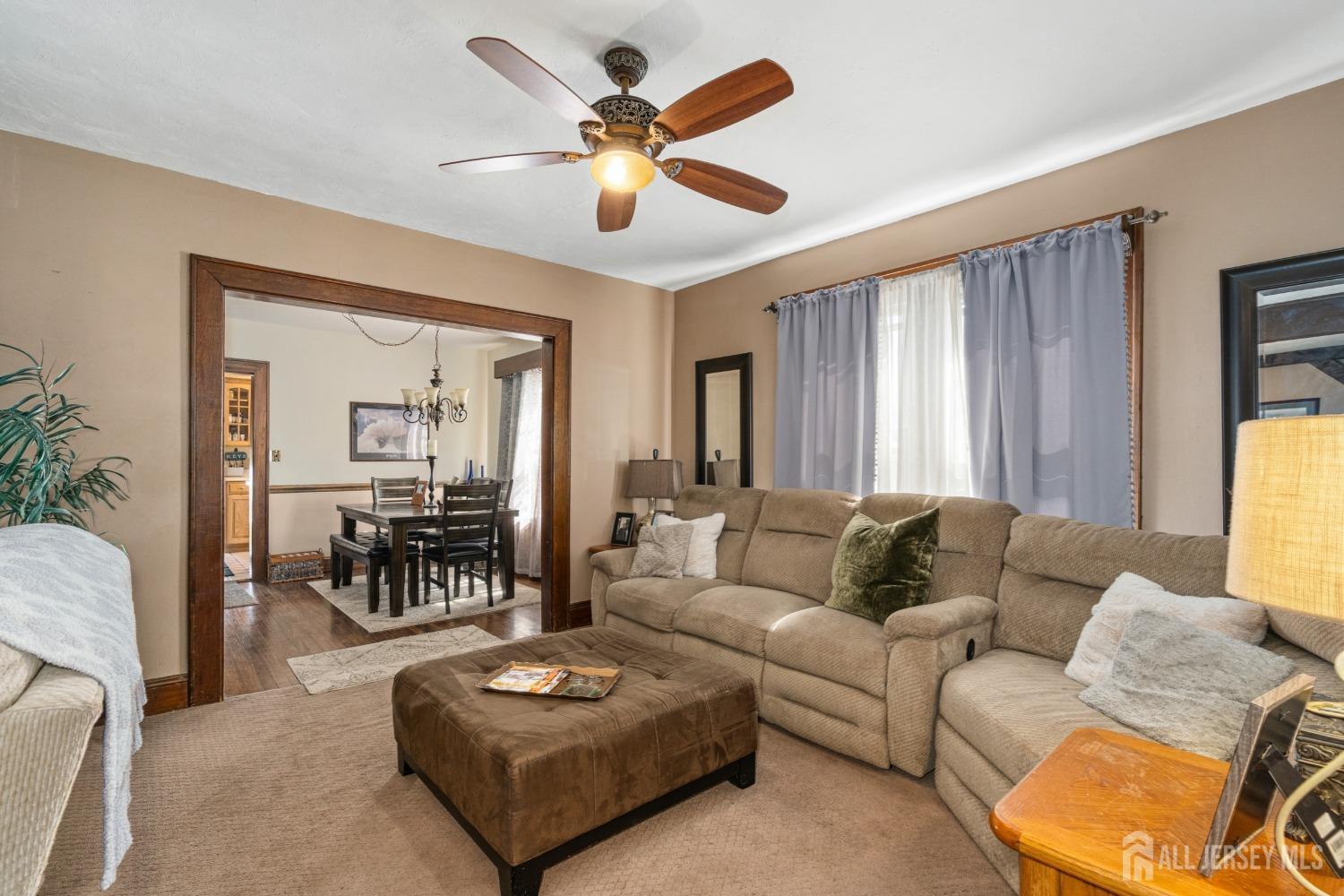 23 Reed Street Edison, NJ 08817 - Photo 8 of 27 a living room with furniture and a large window