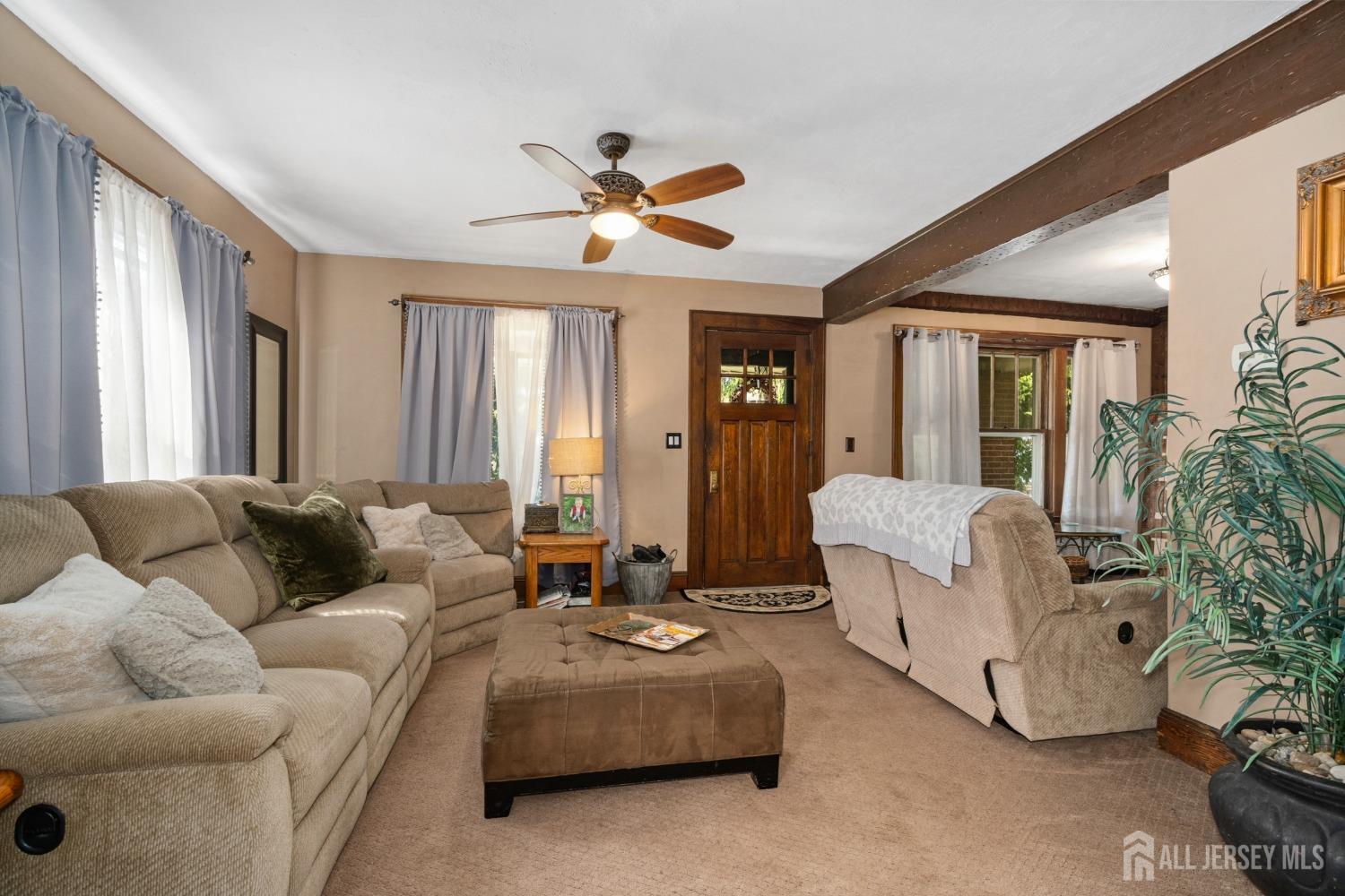 23 Reed Street Edison, NJ 08817 - Photo 10 of 27 a living room with furniture and a large window