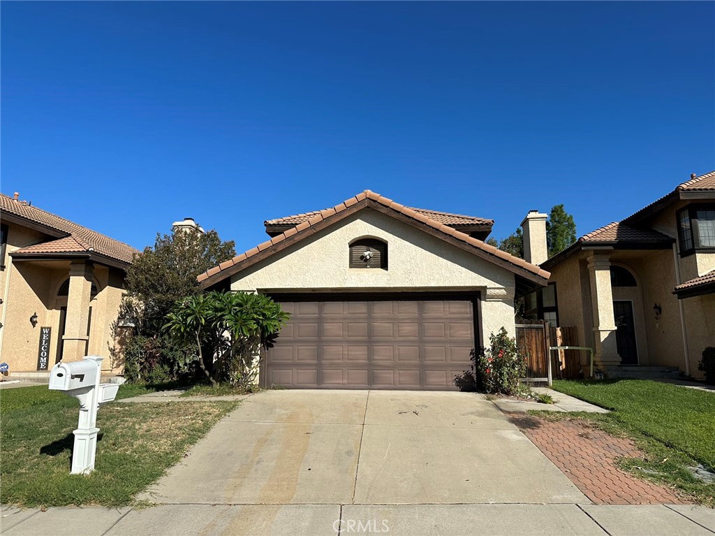 11052 Hastings Court Rancho Cucamonga, CA 91730 - Photo 1 of 14 a front view of a house with garden