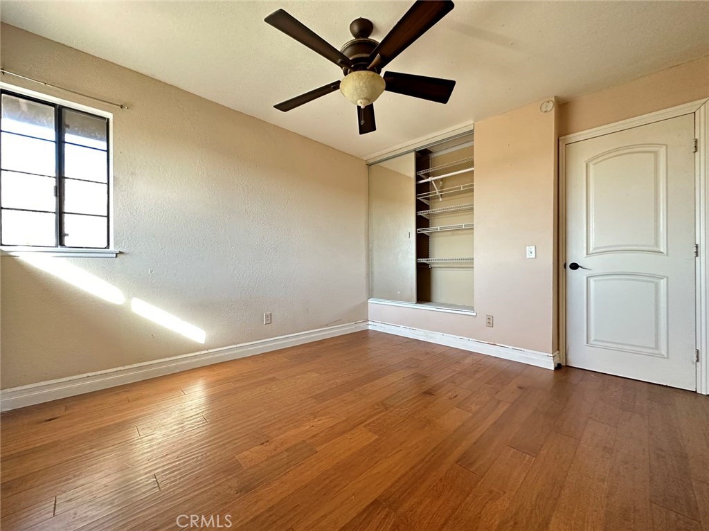 11052 Hastings Court Rancho Cucamonga, CA 91730 - Photo 9 of 14 wooden floor in an empty room with a window