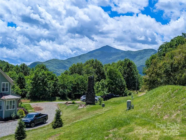 a view of an house with a yard