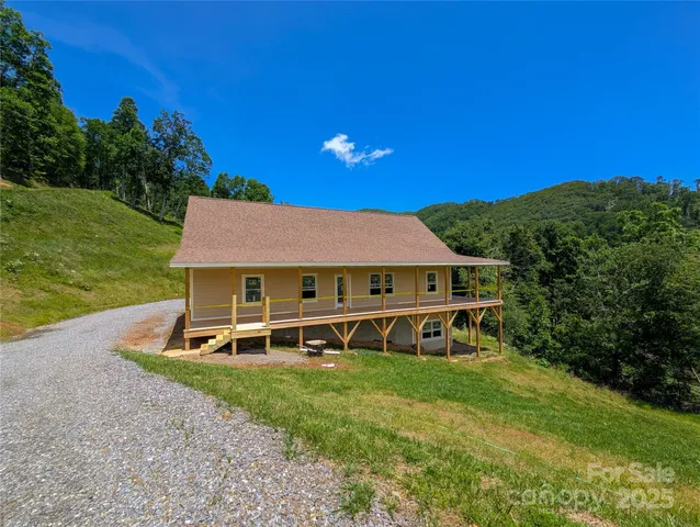 a view of a house with backyard porch and garden