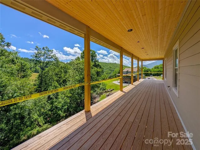 a view of balcony with wooden floor
