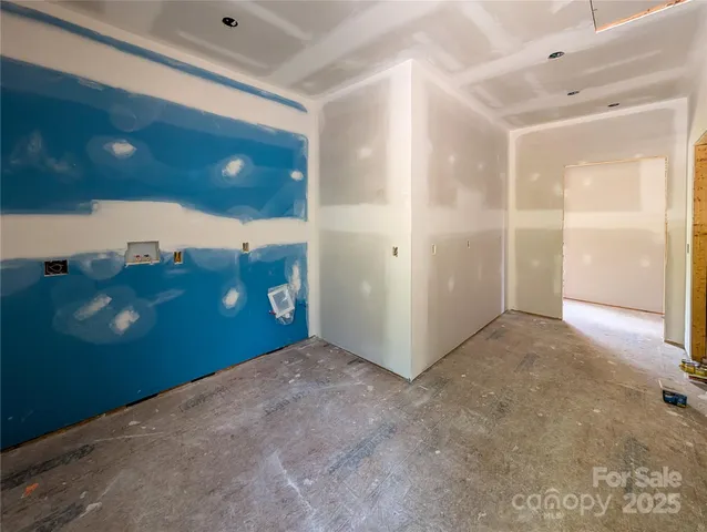 a view of a wooden floor and windows
