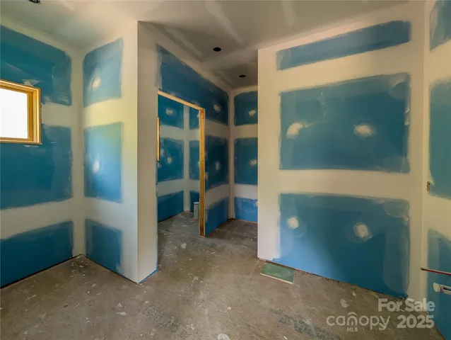 a view of a hallway with bathroom