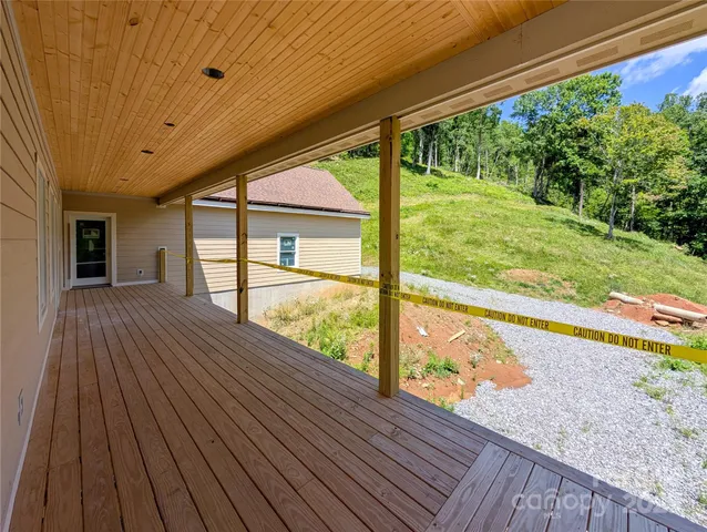 a view of porch with wooden floor
