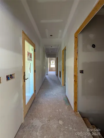 a view of hallway with livingroom
