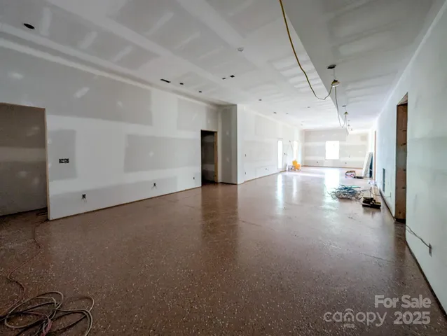 a view of a livingroom with wooden floor