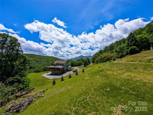 a view of a garden with lawn chairs
