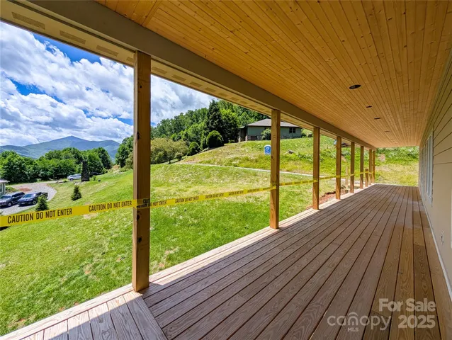 a view of porch with a yard