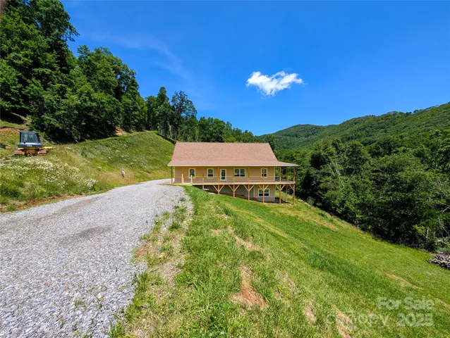 a view of a swimming pool with a yard