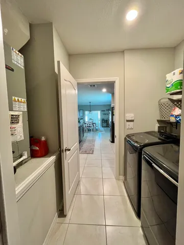 a kitchen with stainless steel appliances granite countertop a refrigerator and a stove