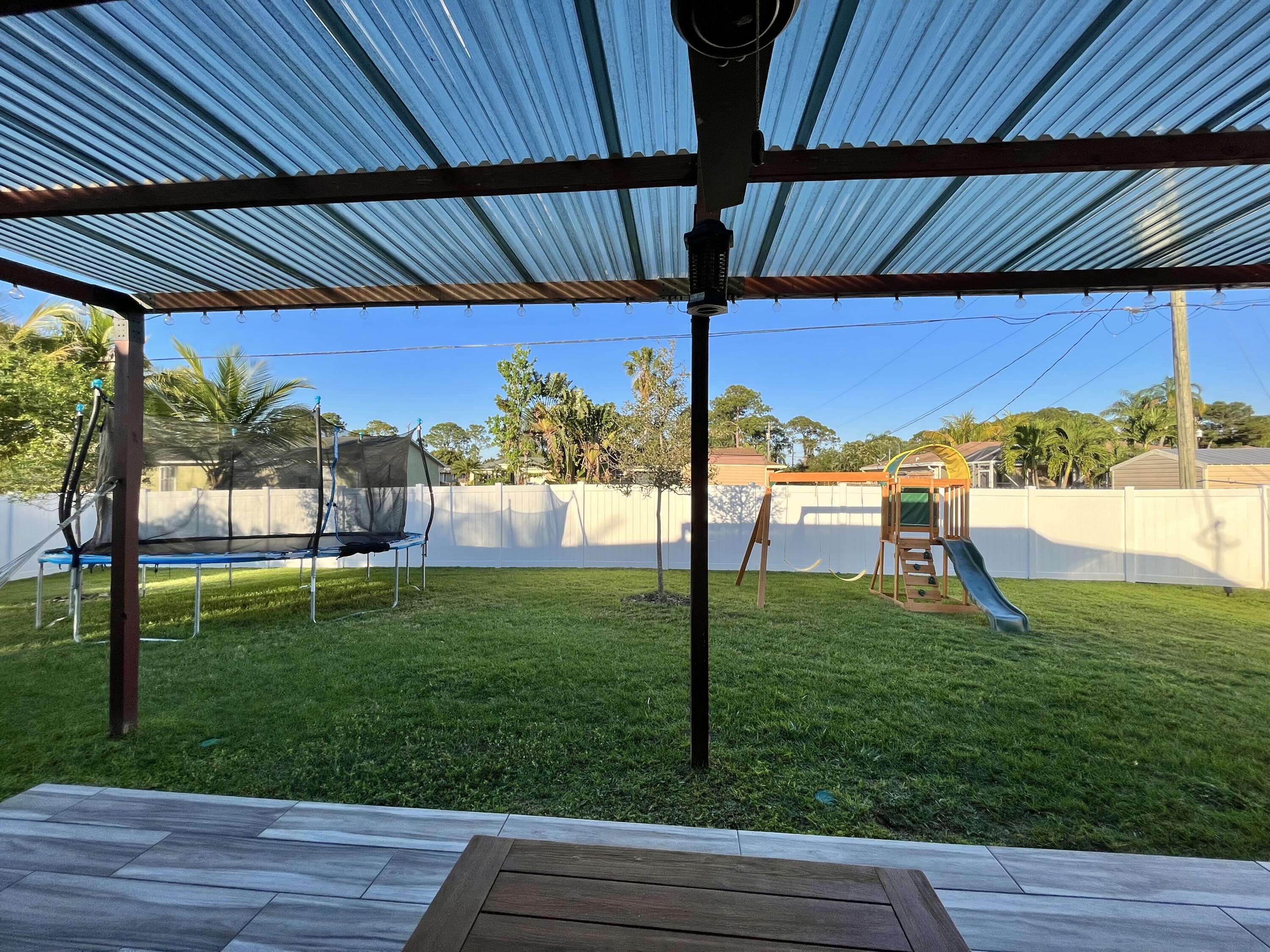 1973 Southwest Libra Lane Port St. Lucie, FL 34984 - Photo 16 of 16 a view of a backyard