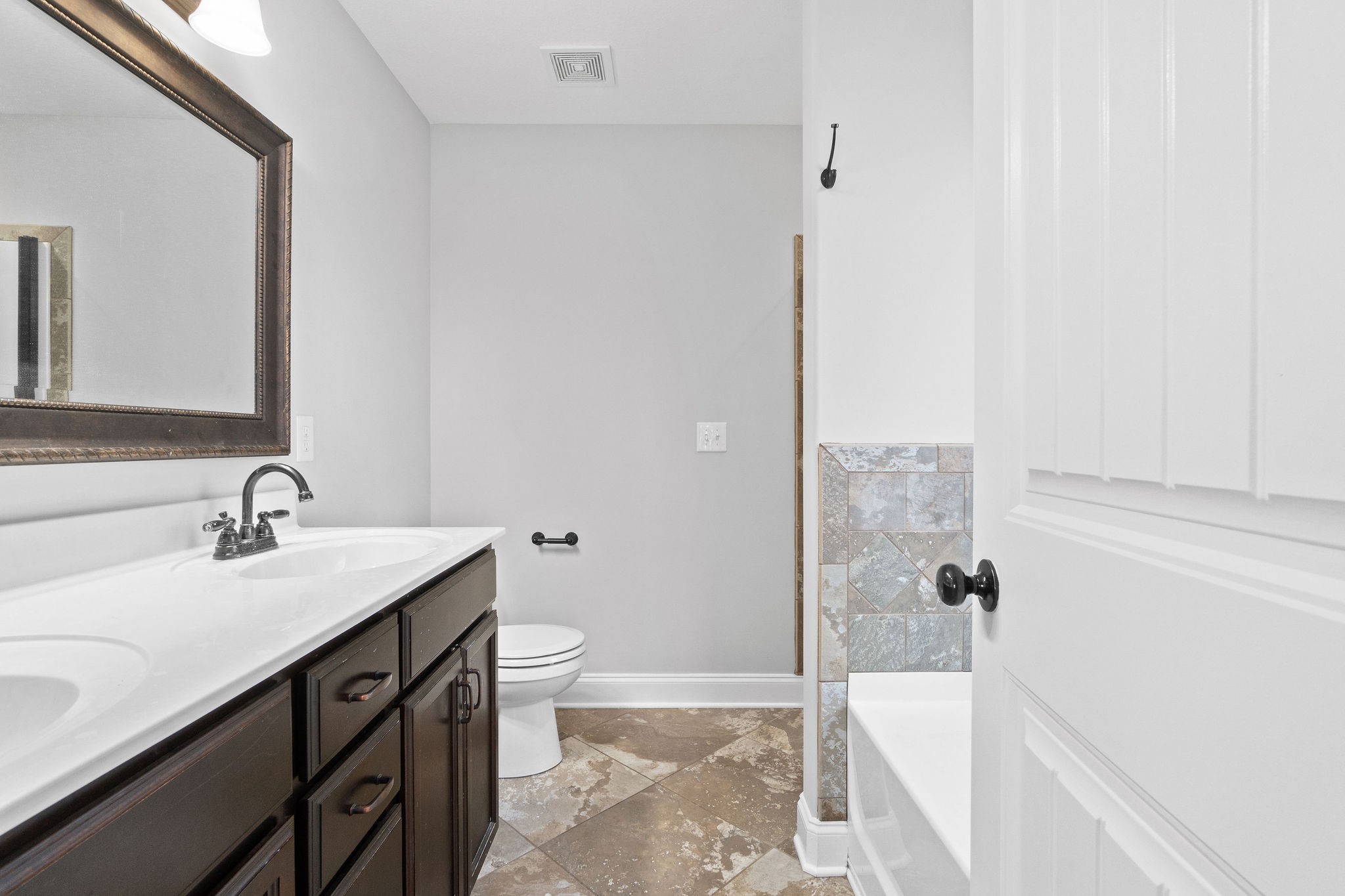 3798 Suiter Road Clarksville, TN 37040 - Photo 16 of 31 a bathroom with a sink a toilet and shower