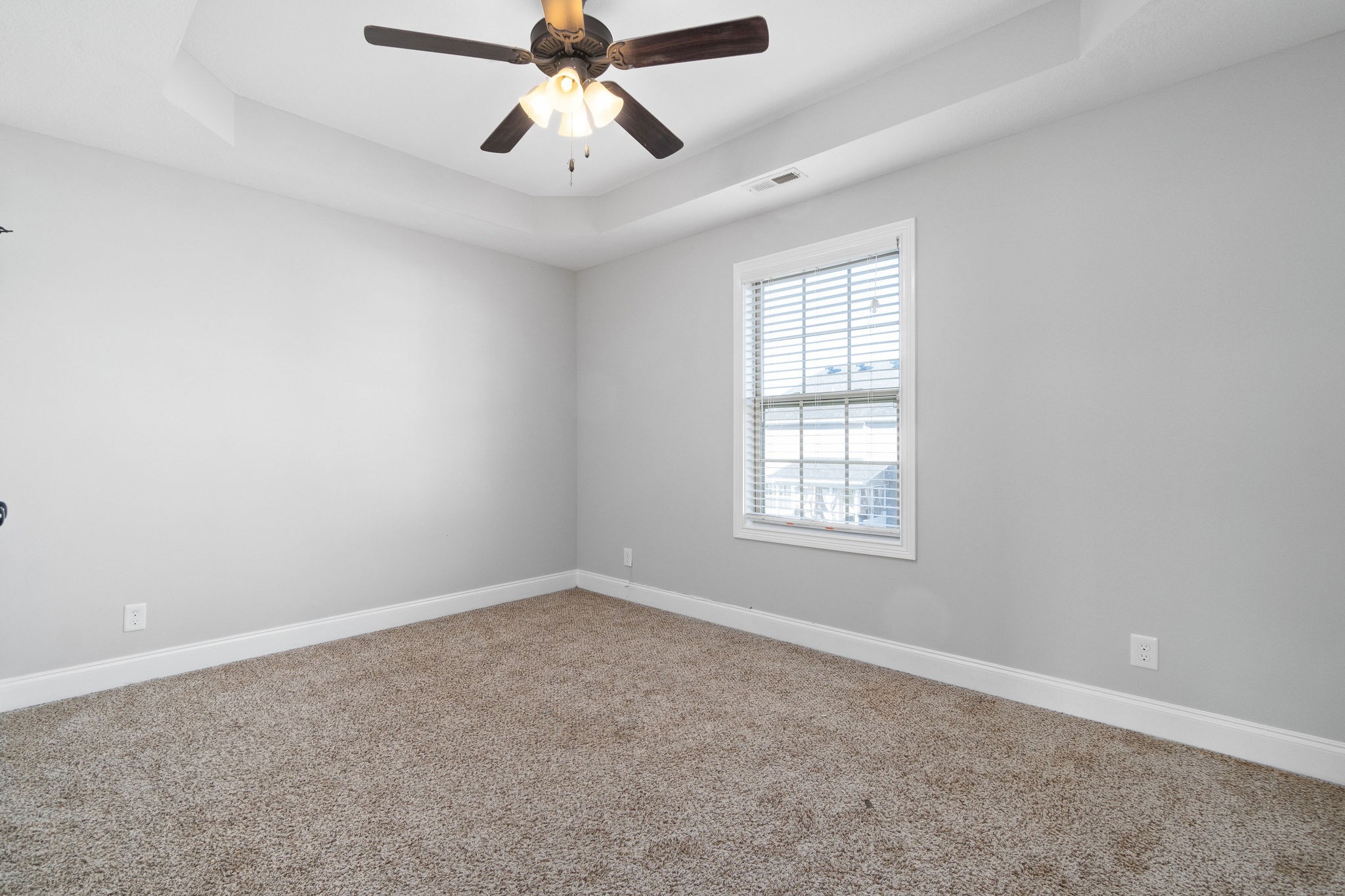 3798 Suiter Road Clarksville, TN 37040 - Photo 23 of 31 an empty room with windows and fan