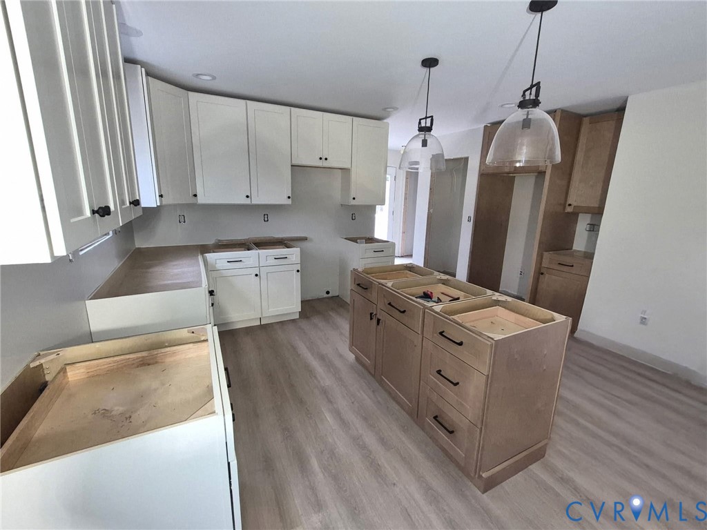 320 Vogel Road Cumberland, VA 23040 - Photo 5 of 20 Kitchen featuring a center island, white cabinets,